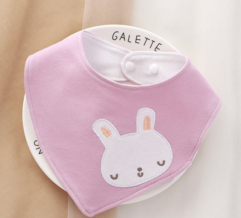 Pink baby bib with a bunny design and 'GALETTE' branding on a neutral background
