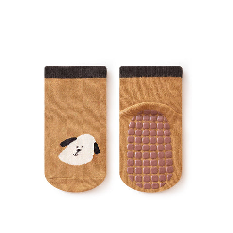 Pair of mustard yellow socks with a dog design on a white background