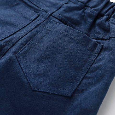 Close-up of blue pants with a pocket on a gray background