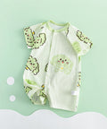 Baby romper with green animal patterns on a light green background