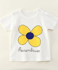 White t-shirt with a yellow flower design and 'Reisenbauer' text on a beige background