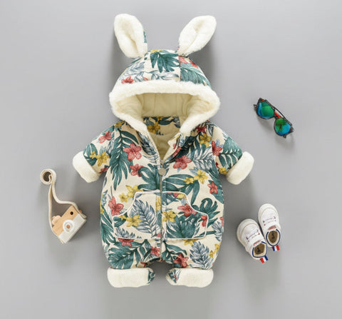 Floral-patterned baby snowsuit with bunny ears on a gray background