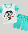 Children's outfit with a white shirt and teal shorts featuring a cartoon face design on a white background.