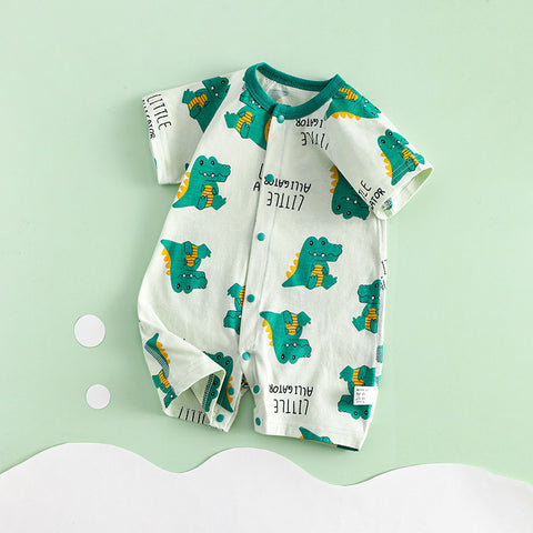 Baby romper with dinosaur pattern on a light green background