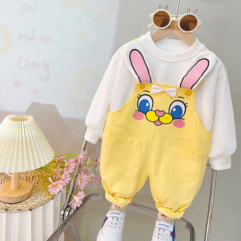 Children's outfit with cartoon bunny ears and face on a yellow romper, white hoodie, and white sneakers.