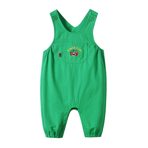 Green children's overalls with dinosaur design on a white background