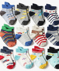 Collection of colorful children's socks on a white background