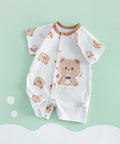Baby romper with bear pattern on a light green background