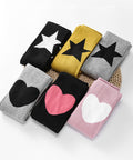 Set of colorful headbands with star and heart designs on a white background