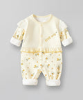 Baby outfit with floral pattern and text on a gray background