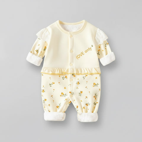 Baby outfit with floral pattern and text on a gray background
