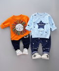 Two children's outfits with orange and navy lion-themed top and blue and navy star-themed top on a gray background.