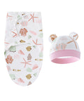 Baby swaddle and hat set with sea-themed design on a white background