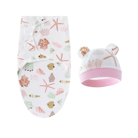 Baby swaddle and hat set with sea-themed design on a white background