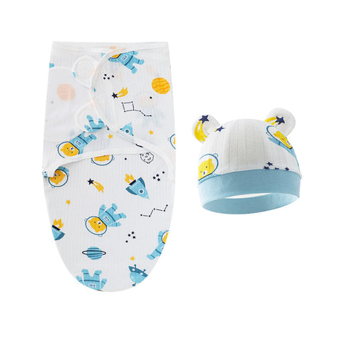 Baby swaddle and hat set with space-themed design on a white background