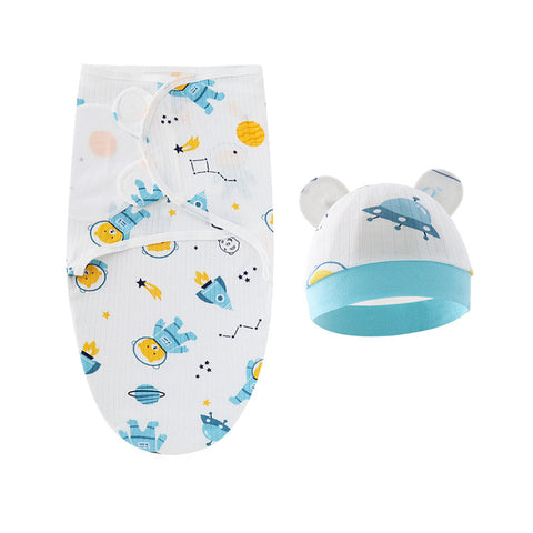 Baby swaddle and hat set with space-themed design on a white background