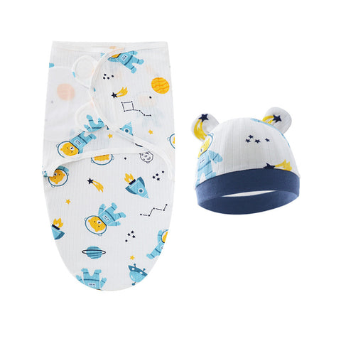 Baby swaddle and hat set with space-themed design on a white background